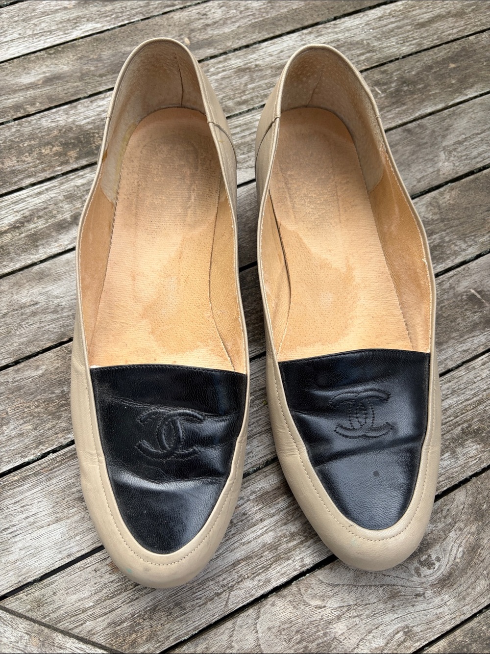 CHANEL Two-Tone Leather Loafers in Black & Beige